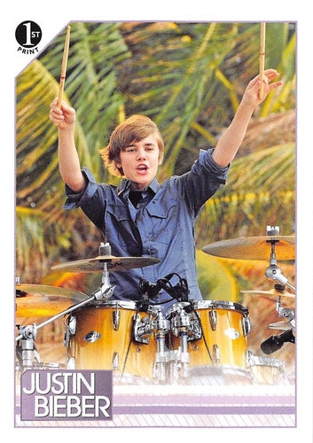 #66 Justin wowed the crowd as he jammed on the dru - 2010 Panini Justin Bieber