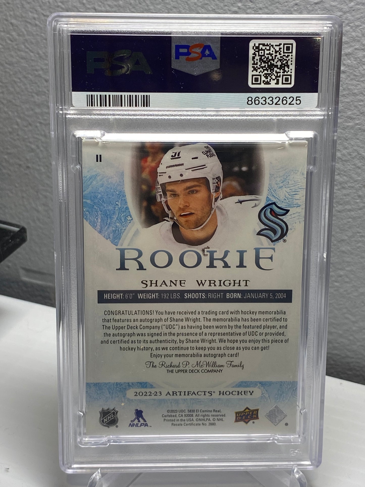 2022-23 Upper Deck Artifacts Emerald Dual Patch Rookie Auto Shane Wright /15 PSA 8