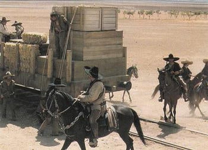 #18 Villistas load explosives onto the railroad - 1992 Pro Set Young Indiana Jones