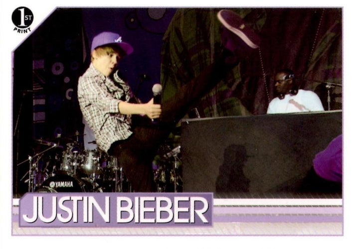#104 Showing the love for his high-kicking hero, Ju - 2010 Panini Justin Bieber