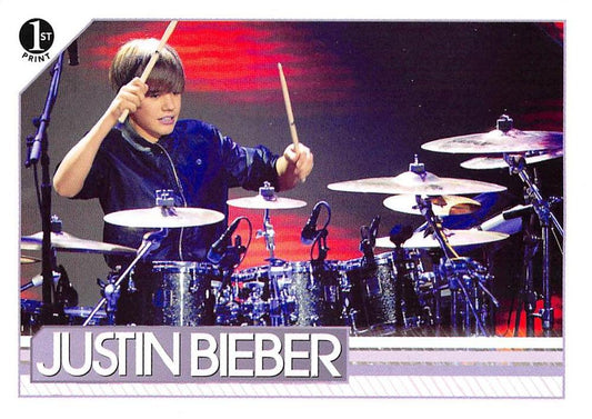 #19 Pulling out a pair of drumsticks during his pe - 2010 Panini Justin Bieber