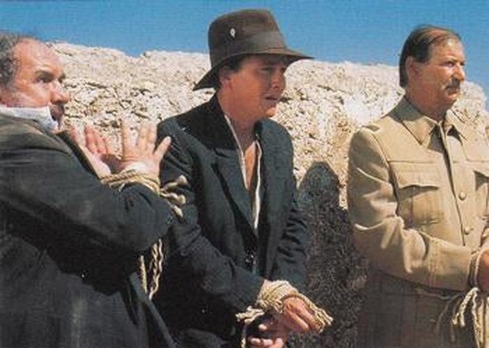 #13 Indy is tied up with two other prisoners, a - 1992 Pro Set Young Indiana Jones